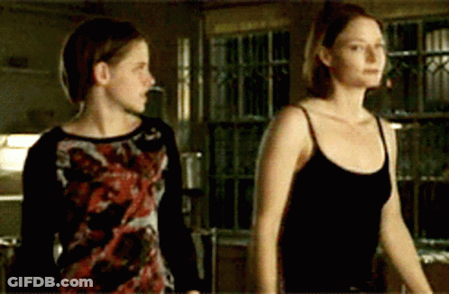 Two Women Standing Together GIF