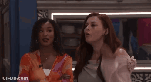 Two Women Standing Together GIF