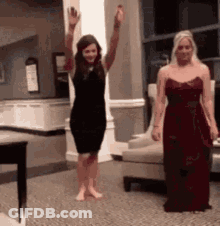 Two Women Standing Together GIF
