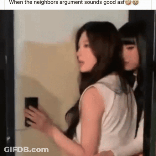Two Women Standing Together One Holding Phone GIF
