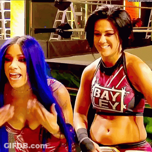 Two Women Standing Together One Wearing Bay Ley Shirt GIF