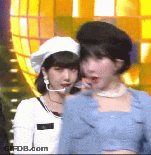 Two Women Standing Together One With Beret GIF