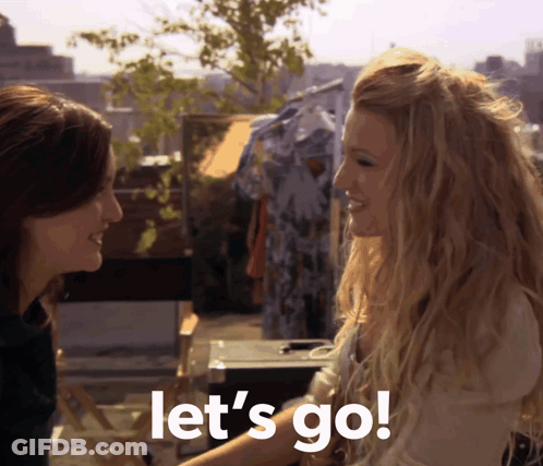 Two Women Standing Together Saying Let's Go GIF