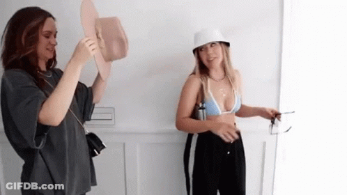 Two Women Standing Together GIF