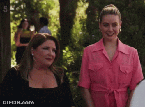 Two Women Standing Together With Number 5 GIF
