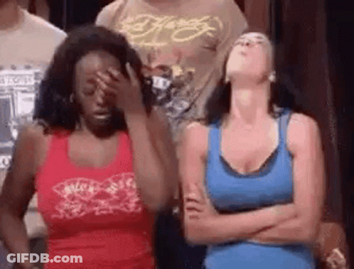 Two Women Standing With Arms Crossed One Covering Face GIF