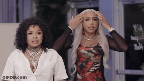Two Women Standing With Hands On Head GIF