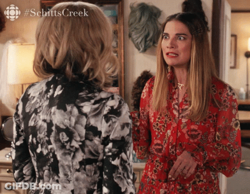 Two Women Standing With Schittscreek GIF