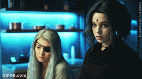 Two Women Standing With TM & 2019 WBEI Watermark GIF