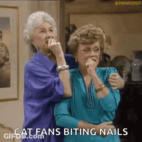 Two Women Talking About Cat Fans Biting Nails GIF
