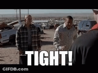 Two Women Talking In Bathroom With I Love You Tattoo GIF