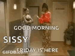 Two Women Talking In Hallway GIF