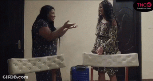 Two Women Talking In Room GIF