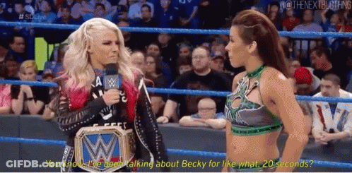 Two Women Talking In Wrestling Ring One Wearing WWE Belt GIF