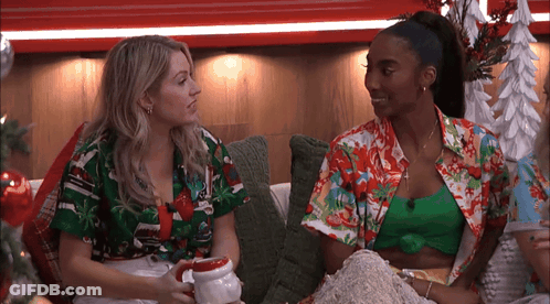 Two Women Talking On Couch GIF