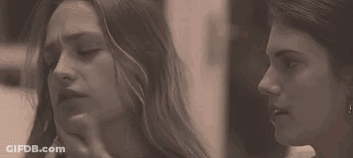 Two Women Touching Faces GIF