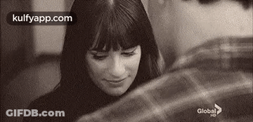 Two Women Touching Faces At Night GIF