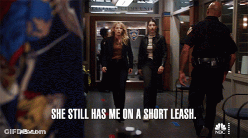 Two Women Walking Down Hallway She Still Has Me On A Short Leash GIF