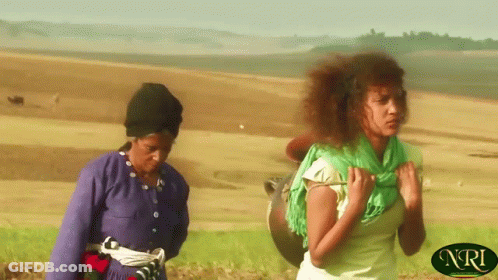 Two Women Walking In Field With NRI GIF