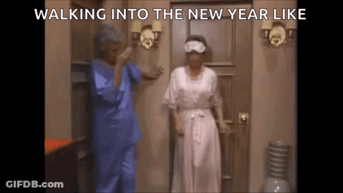 Two Women Walking Into New Year Wearing Sleep Masks GIF