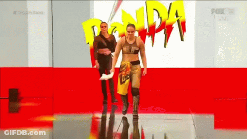 Two Women Walking Red Carpet Ronda Rousey Sign GIF