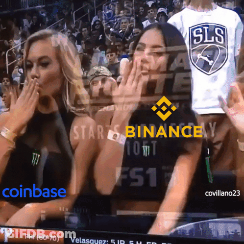 Two Women Watching Game With Binance On Screen GIF