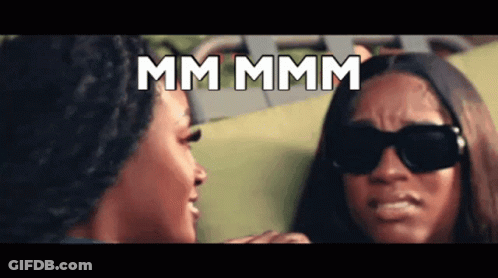 Two Women Wearing Sunglasses Are Looking At Each Other And The Words Mm Mmm Are Displayed Above Them GIF