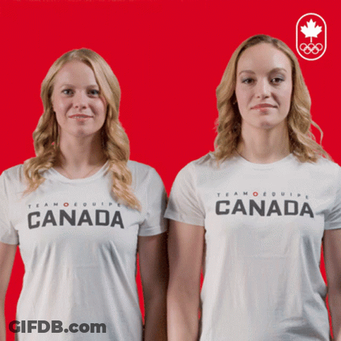 Two Women Wearing White Shirts That Say Canada On Them GIF