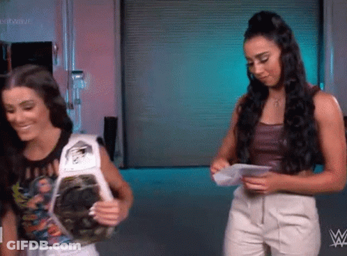 Two Women With Championship Belt GIF