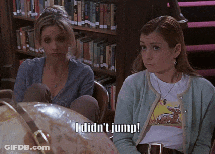 Two Women With Globe Saying I Didn't Jump GIF