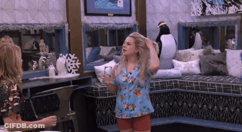 Two Women With Penguin On Wall GIF