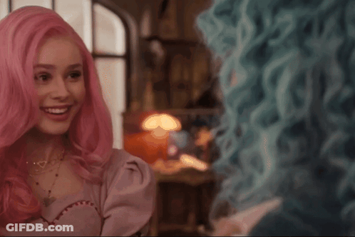 Two Women With Pink And Blue Hair Smiling GIF