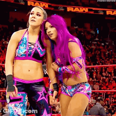 Two Women With Purple Hair Standing In Ring GIF