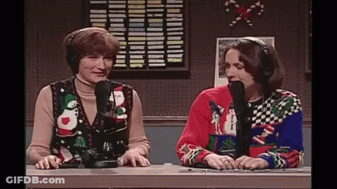 Two Women With Ugly Christmas Sweaters And Microphones GIF