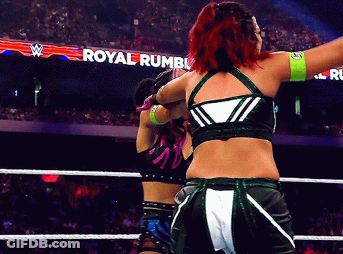 Two Women Wrestling In A Ring Saying Royal Rumble GIF