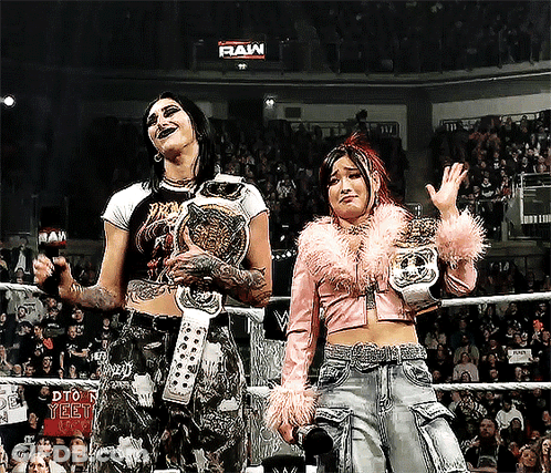 Two Women Wrestling In Ring Saying Raw GIF