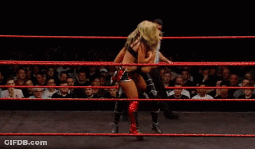 Two Women Wrestling In Ring With Referee GIF