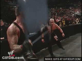 Two Wrestlers Are Fighting In A Ring With A Watermark That Says Gifsoup.com On The Bottom GIF