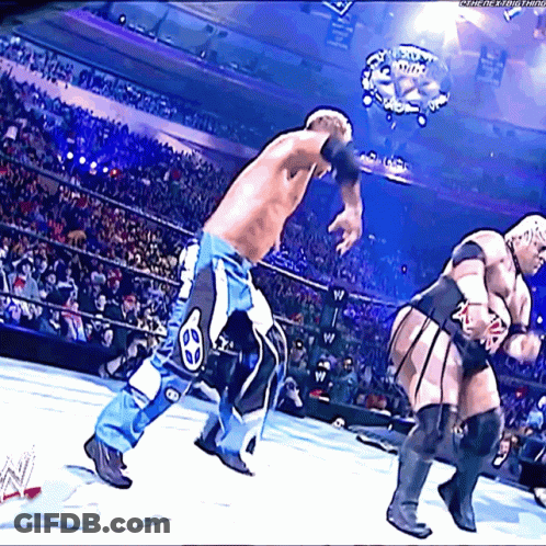 Two Wrestlers Are Fighting In A Wrestling Ring With A Watermark That Says ' Wwe ' On It GIF
