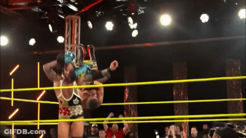 Two Wrestlers Are In A Ring And One Of Them Is Wearing A Shirt That Says ' A ' On It GIF