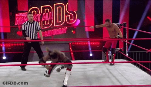 Two Wrestlers Are In A Ring With A Referee In Front Of A Screen That Says Against All Odds Saturday GIF