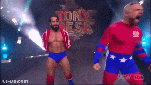 Two Wrestlers Are Standing In Front Of A Sign That Says Tony Jesse GIF