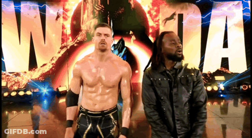 Two Wrestlers Are Standing In Front Of A Sign That Says Wwe GIF