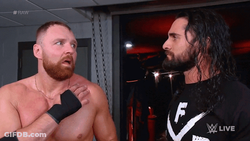 Two Wrestlers Are Standing Next To Each Other And One Has A Shirt That Says F On It GIF