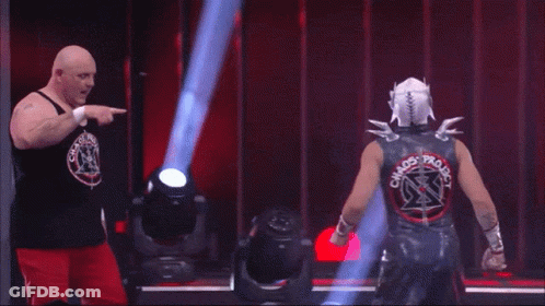 Two Wrestlers Are Standing Next To Each Other And One Has The Name Serpentico On The Screen GIF