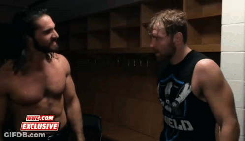 Two Wrestlers Are Standing Next To Each Other In A Locker Room With A Wwe.com Exclusive Logo On The Bottom GIF