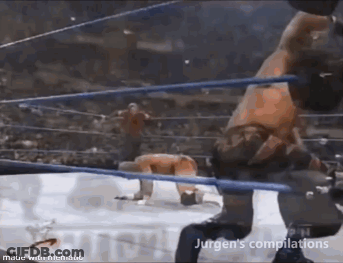 Two Wrestlers Fighting In Ring With Crowd GIF