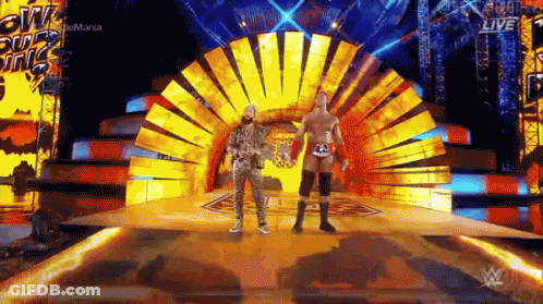 Two Wrestlers Fighting In Ring With Referee GIF