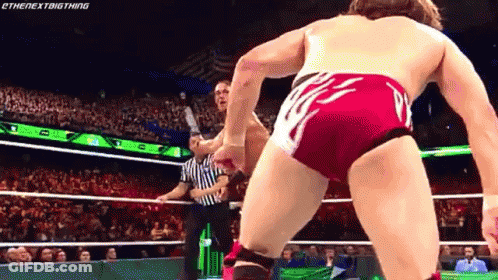 Two Wrestlers Fighting In Ring With Referee GIF