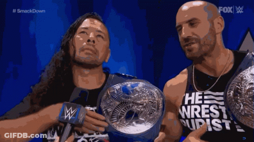 Two Wrestlers Holding Championship Belts Fox GIF